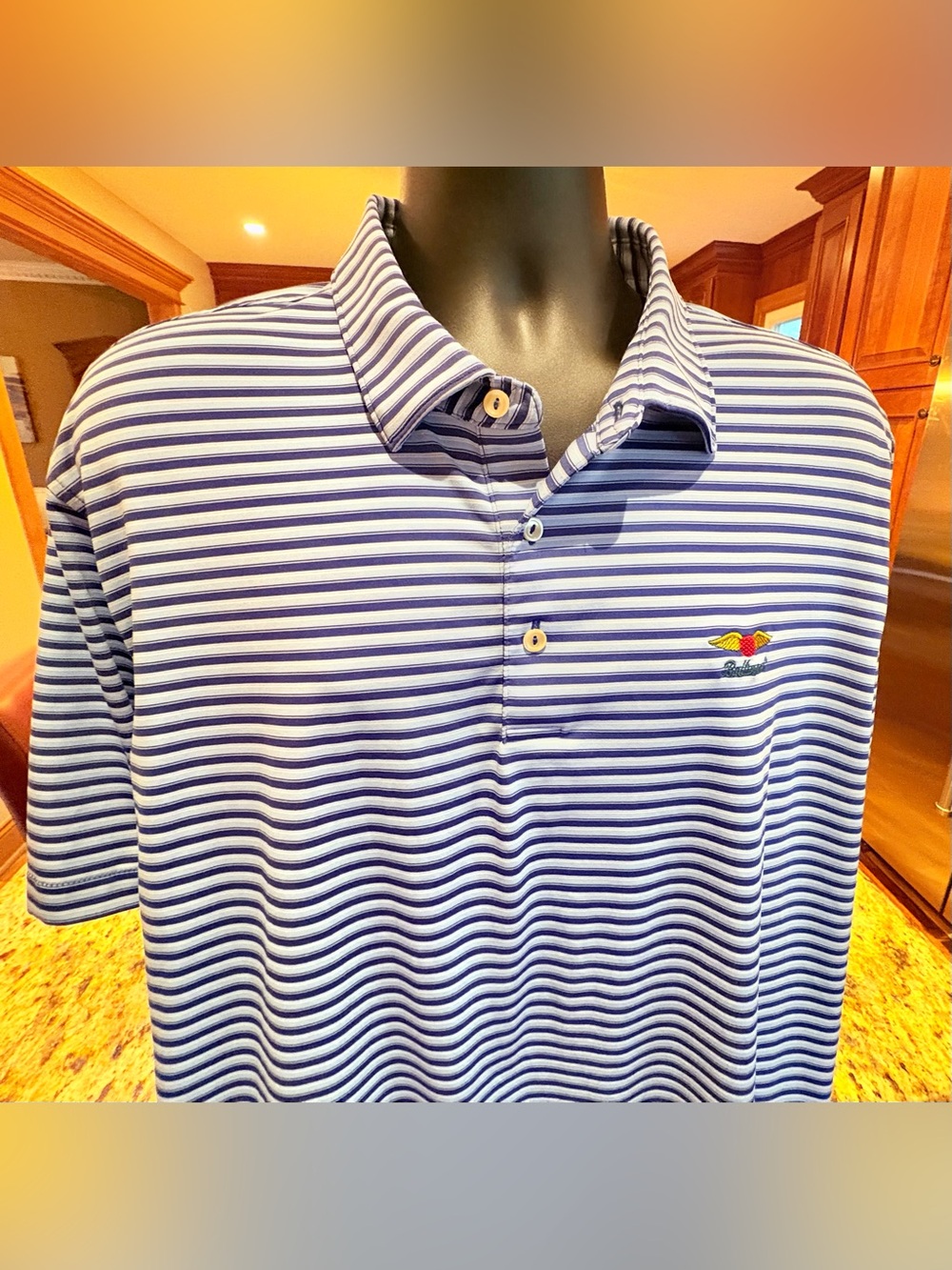 Peter Millar men’s performance polo. Sharp blue/white striped w/Baltusral logo